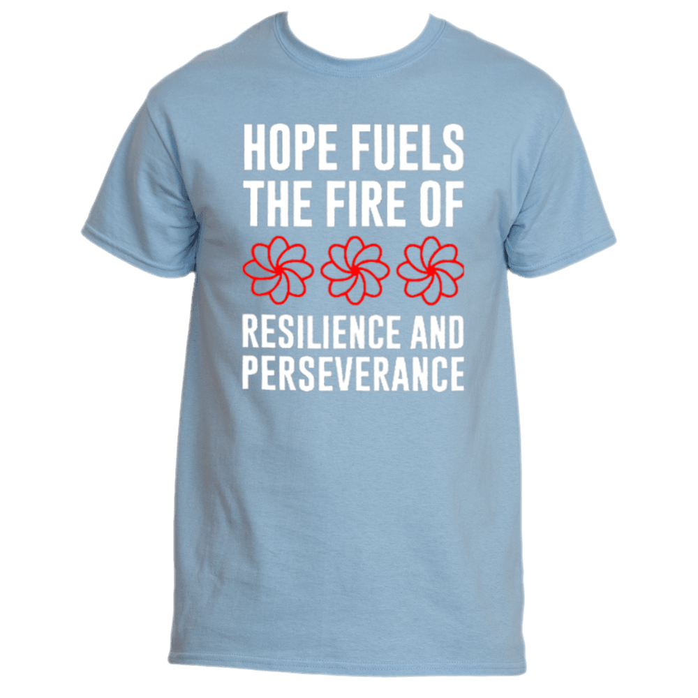 The Hope Fuels T-Shirt by Divine Dispatch is a Carolina Blue shirt showcasing the uplifting white text, "Hope fuels the fire of resilience and perseverance," accompanied by three red floral designs. This tee serves as more than just apparel; it is also a symbol of support for charitable initiatives.