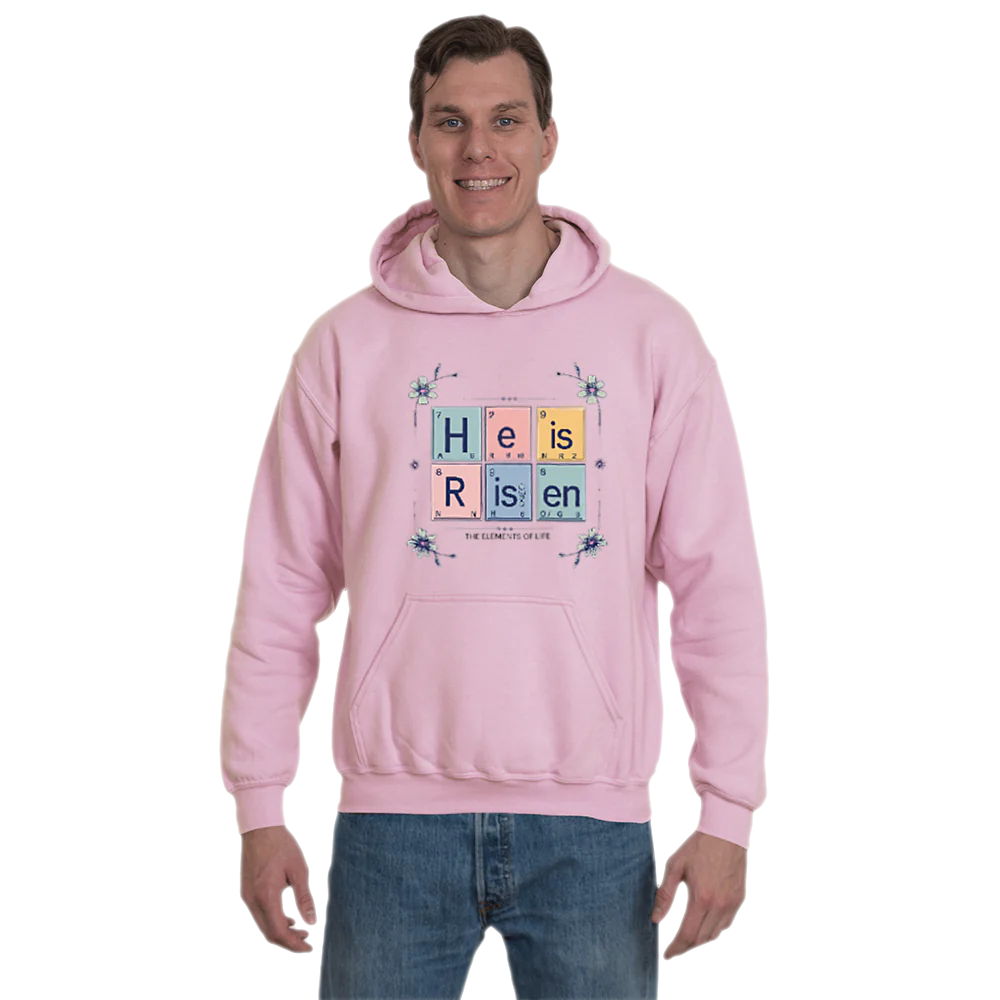 Person wearing a pink hoodie with a colorful design that says &quot;He is Risen&quot; and features floral accents.