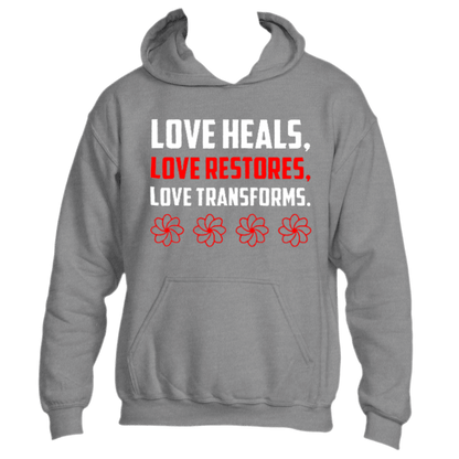 The Divine Dispatch Love Heals Hoodie prominently displays the phrase &quot;Love Heals, Love Restores, Love Transforms&quot; in bold white and red lettering above four vibrant red flowers. Experience the transformative power of love with this cozy piece of apparel.