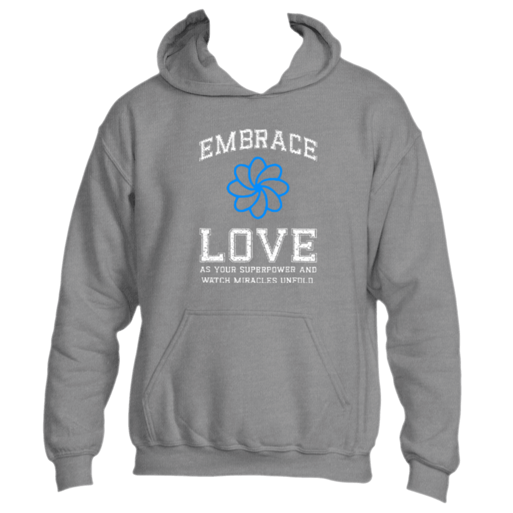 This Embrace Love Hoodie by Divine Dispatch showcases a dark heather grey base with a blue flower design and the inspiring message, &quot;Embrace Love as Your Superpower and Watch Miracles Unfold.&quot; Made from premium fabric, it is both stylish and a perfect reminder to carry positivity wherever you go.