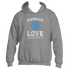 This Embrace Love Hoodie by Divine Dispatch showcases a dark heather grey base with a blue flower design and the inspiring message, "Embrace Love as Your Superpower and Watch Miracles Unfold." Made from premium fabric, it is both stylish and a perfect reminder to carry positivity wherever you go.