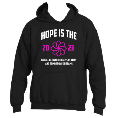 The &quot;Hope is the Bridge Hoodie&quot; by Divine Dispatch is a motivational garment with a black background that displays the phrase &quot;Hope is the Bridge between today&