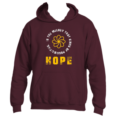 The &quot;Hope is the Melody&quot; hoodie by Divine Dispatch showcases a maroon design with a vibrant yellow flower graphic and the uplifting message, &quot;Hope is the melody that sings possibilities,&quot; representing charitable initiatives for those in need.